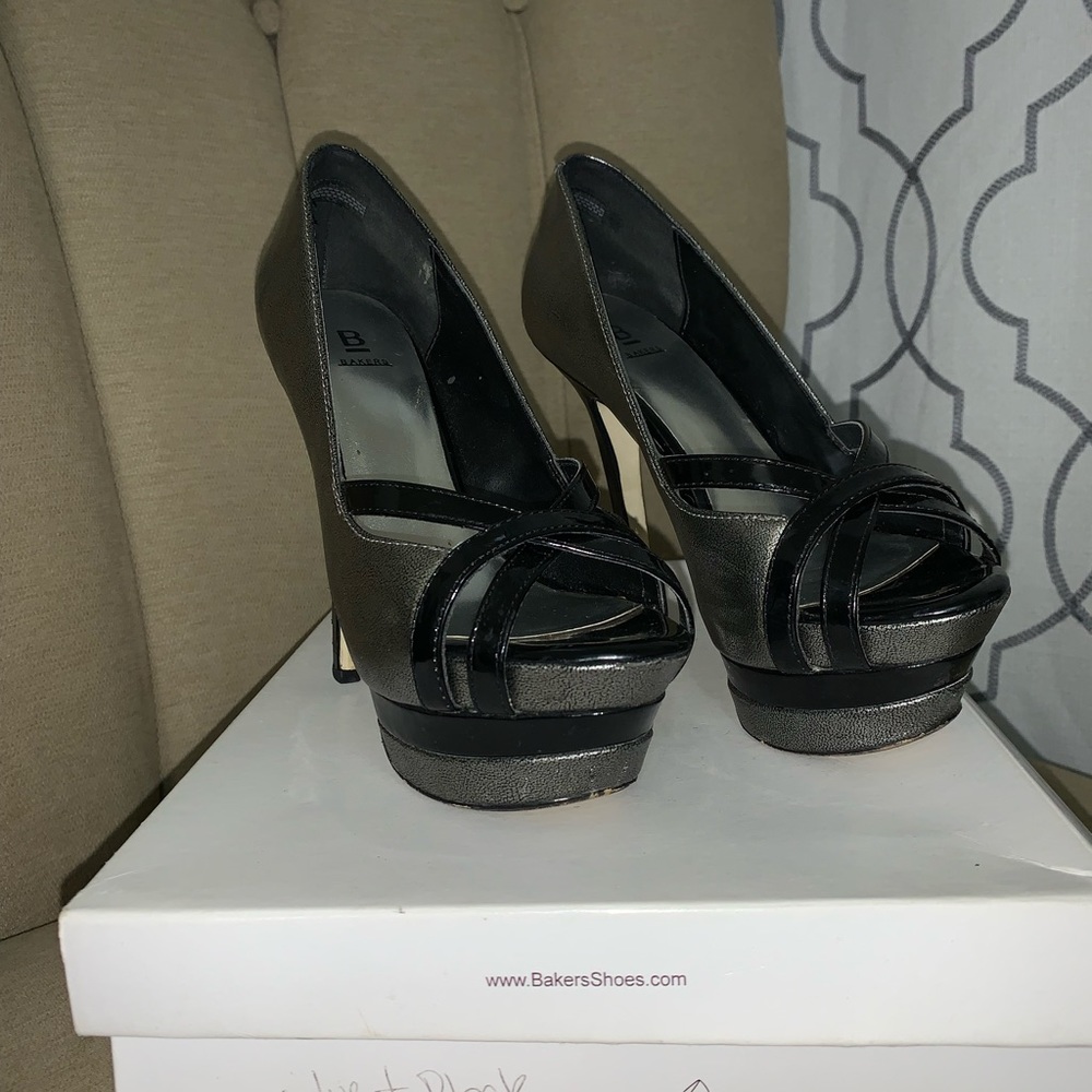 Used women’s black and silver/gray platform heels. Size 6 Bakers brand